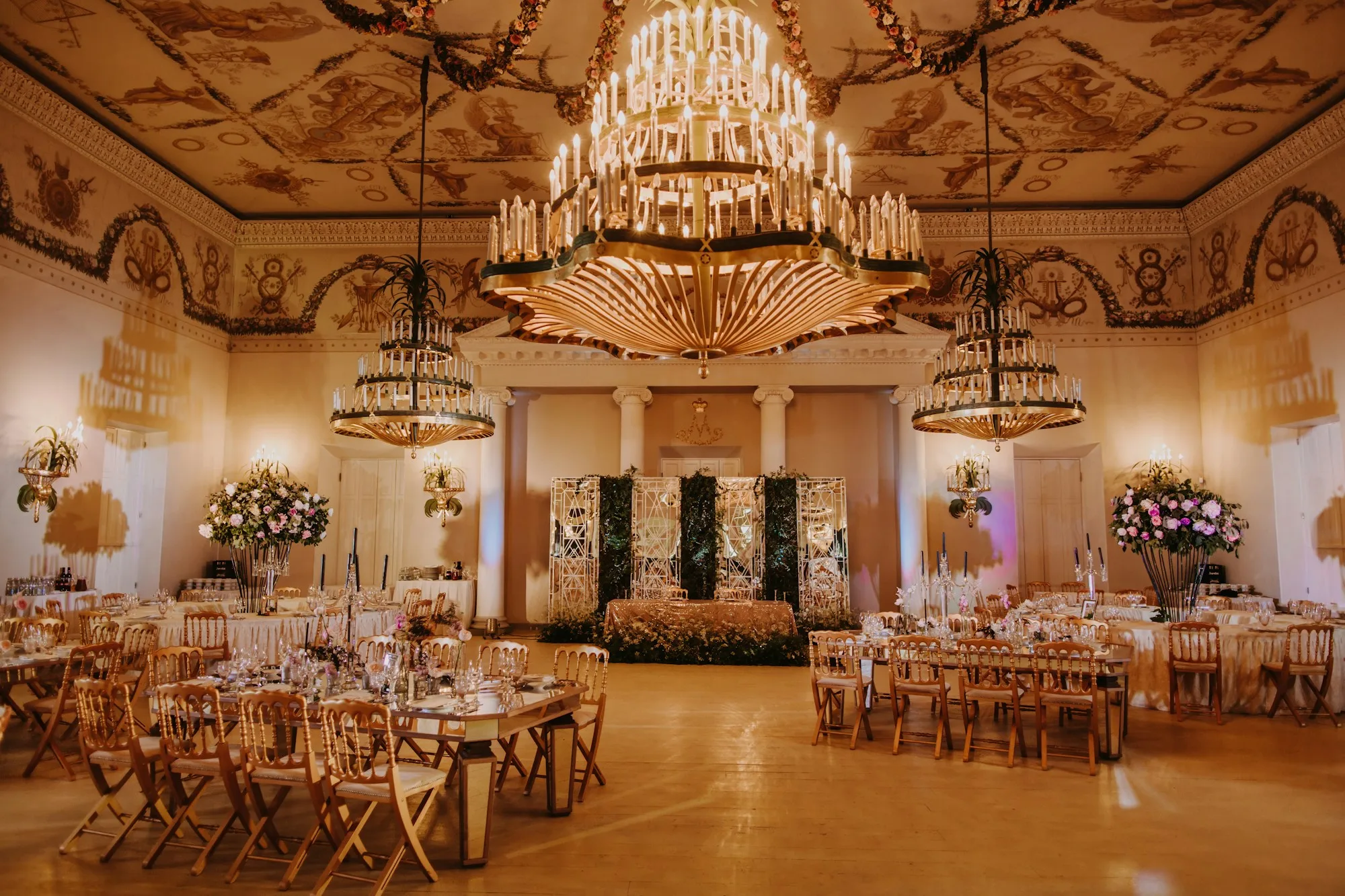 An intimate, golden-lit reception room set for a celebration